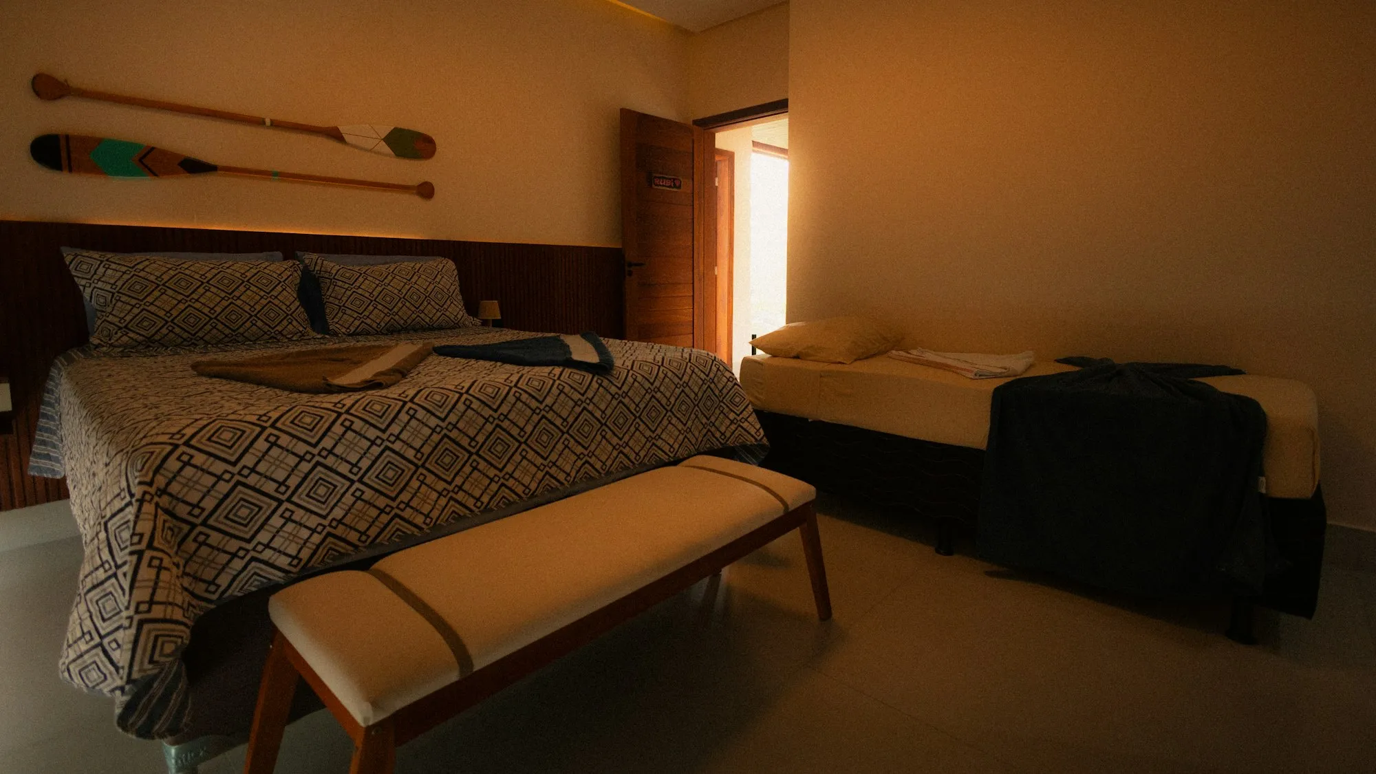 Second bedroom with two twin beds and playful nautical decor